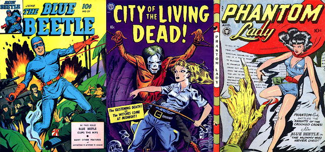 Blue Beetle #31 depicts a man clad in a blue scaly costume with a blue domino mask, red gloves, and a red belt. He is fighting Japanese soldiers in a WWII battle. There's a tank behind him with American soldiers. The City of the Living Dead cover shows a blond, white woman adventurer holding a whip. She stands in a cave full of human bones in front of a white-faced corpse that's been tied up by the wrists. The cover of Phantom Lady shows a dark haired white woman in a skimpy blue costume with a red belt and red cape. She is standing in front of a giant page with writing that is being read by an emaciated yellow hand with long finger nails.