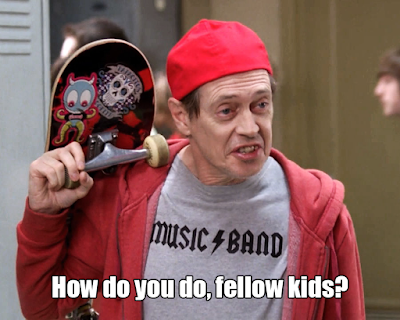 A photo of a fifty-something Steve Buschemi wearing a backwards baseball hat, a T-shirt that says “Music Band” with lightning bolt in the middle (similar to the AC/DC logo), and a red hoodie. He has a skateboard slung over his shoulder and you can see high school lockers in the background. The photo says “How do you do, fellow kids?” at the bottom.